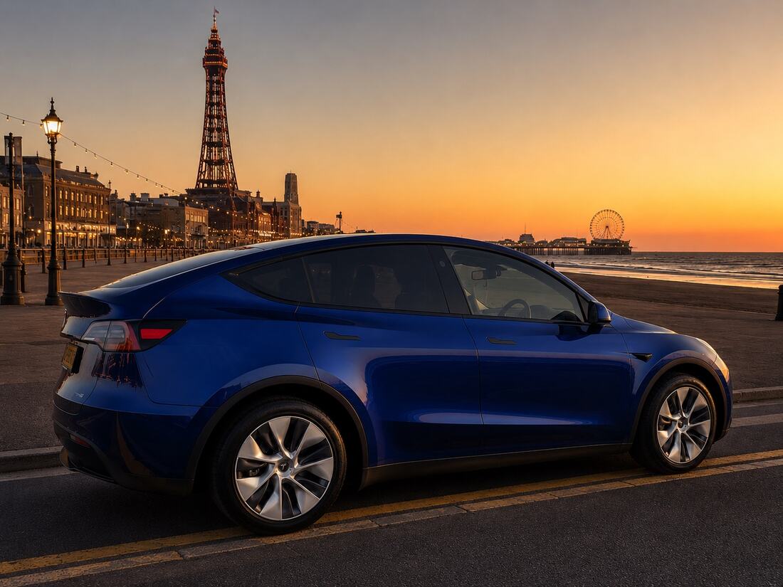 EV Exec Tesla Model Y on Blackpool promenade at sunset with Blackpool Tower behind